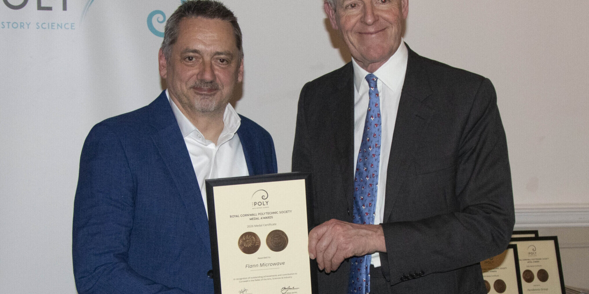 Flann receiving an award for outstanding achievement and contribution to Cornwall in the field of Industry at The Poly Awards 2026